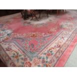 A large pink ground Chinese rug A/F