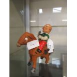 A mid-20th century tin plated mechanical horse toy