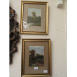 A pair of framed and glazed possible oils of countryside