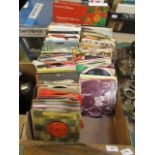 A tray containing an assortment of 45 RPM singles to include Foundations, Madonna,