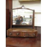 An early 19th century mahogany, boxwood strung and rosewood banded toilet mirror,