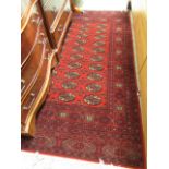 A rectangular red ground rug