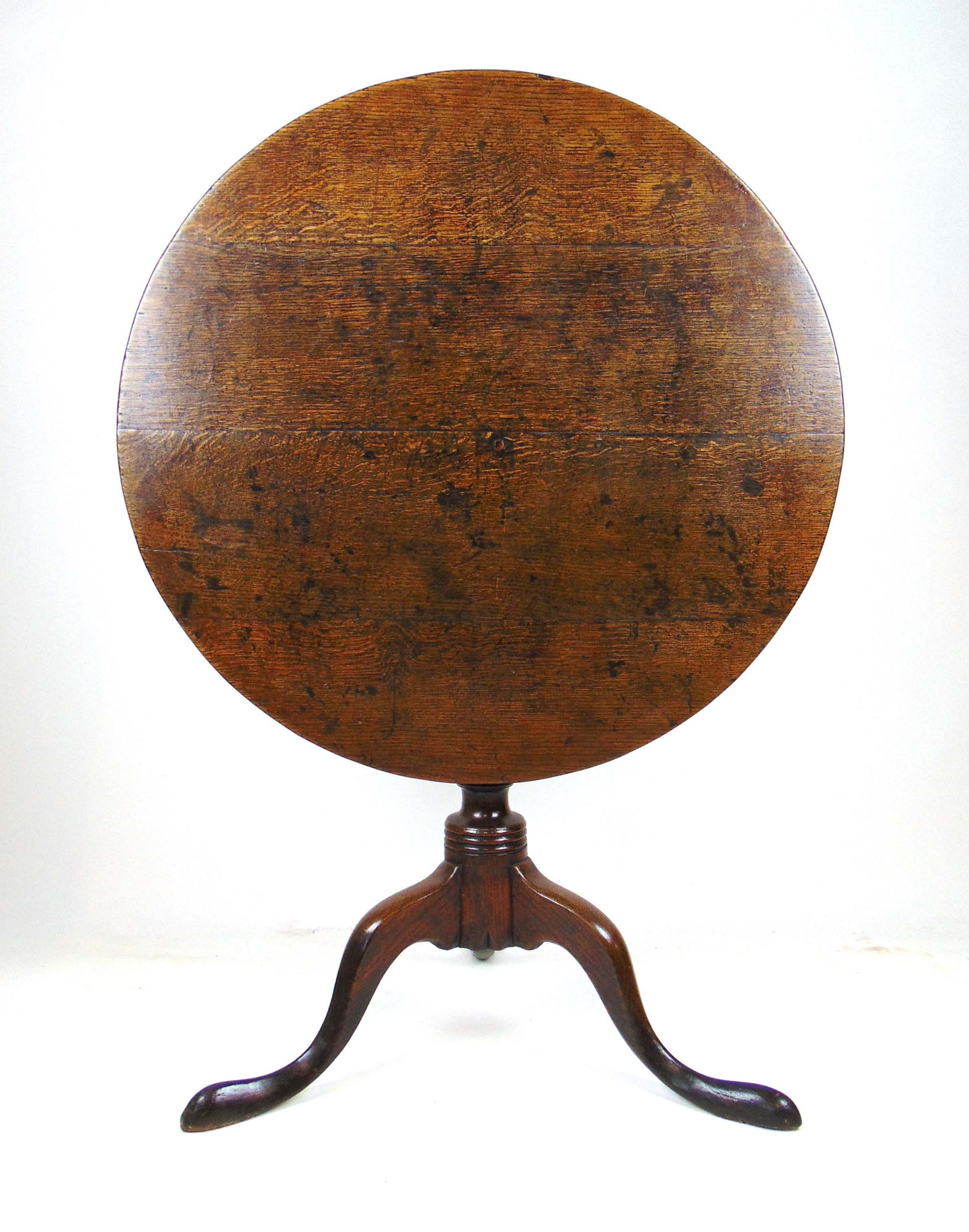 An 18th century oak tilt top tripod table, the circular top over turned column and three swept legs, - Image 2 of 2