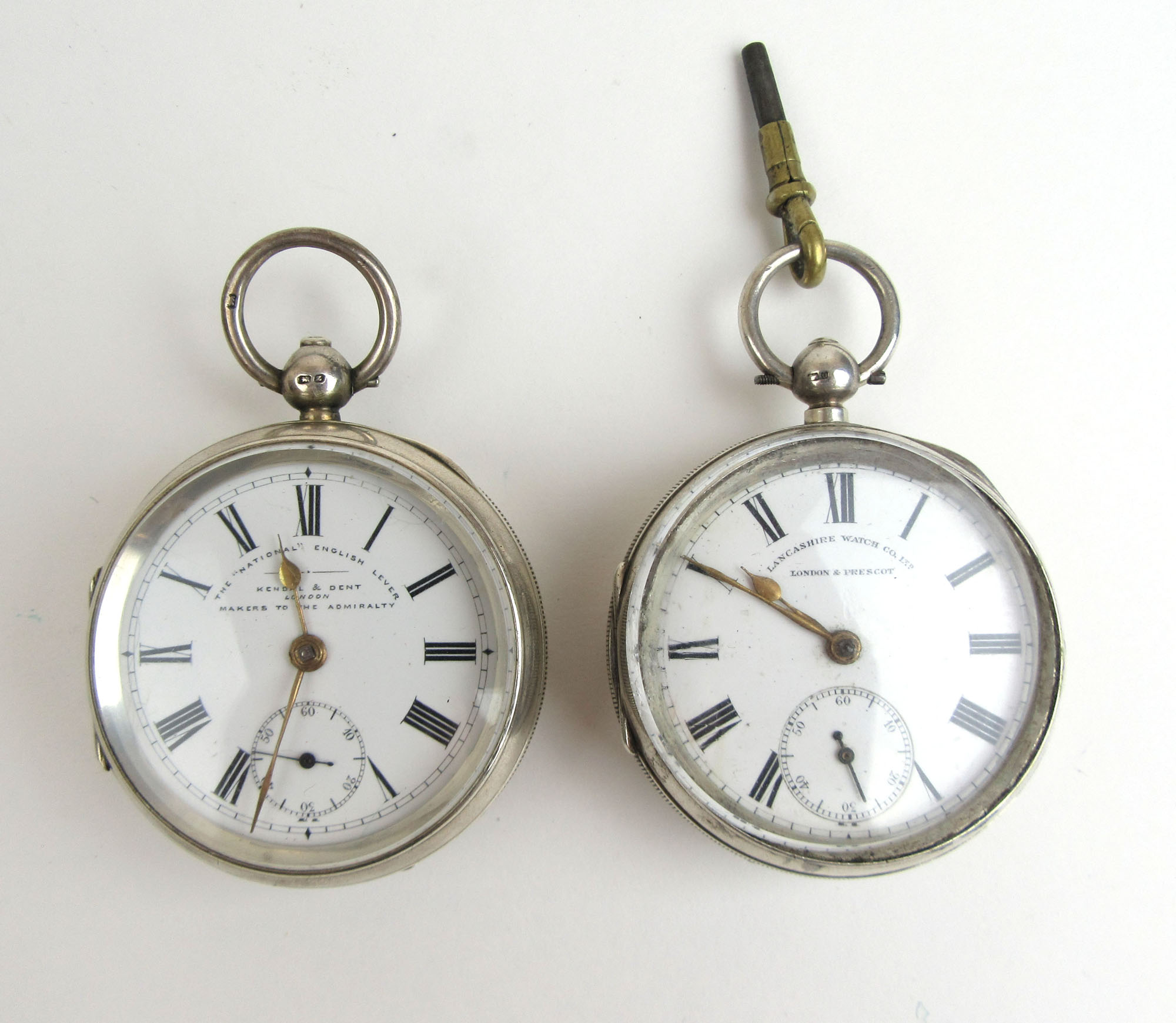 A silver 'National English Lever' pocket watch by Kendal & Dent together with a silver cased pocket