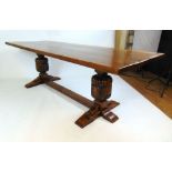 A reproduction 17th century style oak dining table,