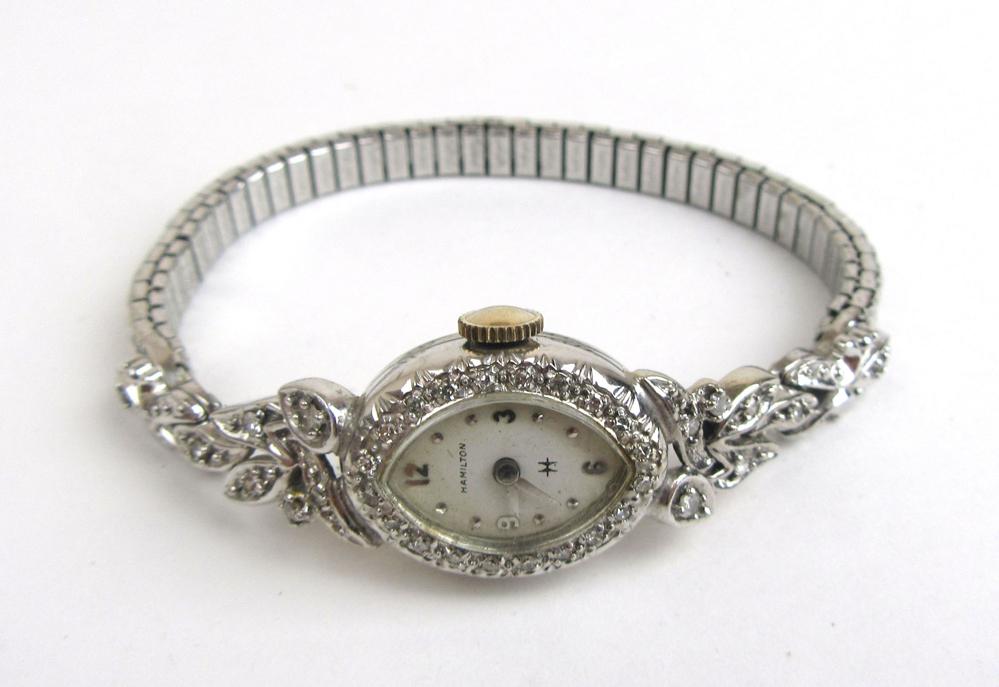 A mid 20th century ladies white metal and diamond set Hamilton cocktail watch marked '14k'