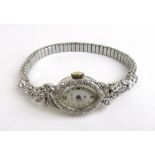 A mid 20th century ladies white metal and diamond set Hamilton cocktail watch marked '14k'