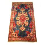 A handwoven Persian wool rug,