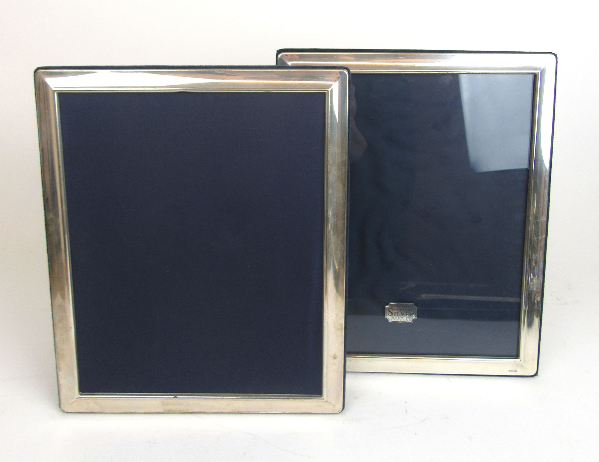 A pair of large silver photo frames. Hallmarked for Sheffield 1995 & 1996.