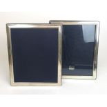 A pair of large silver photo frames. Hallmarked for Sheffield 1995 & 1996.