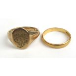 A 9ct gold engraved signet ring together with a 22ct gold wedding band. Approx weights 6.5g & 2.