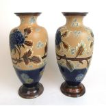 A pair of early 20th century Doulton Lambeth stoneware vases having foliate decoration, h.