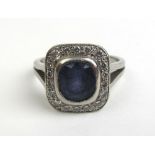 A platinum, diamond and purple stone cluster ring,