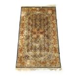 A handwoven Indian silk rug,