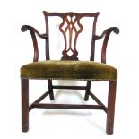 A Georgian mahogany open arm chair, the pierced splat and carved ,