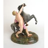 A late 19th/early 20th century continental porcelain model of a rearing horse and rider.