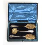 A cased set of Georgian silver table spoons together with a Victorian silver ladle having later