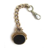 An early 20th century 9ct gold carnelian and bloodstone spinner fob on a 9ct gold part Albert chain.