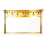 A reproduction neoclassical style giltwood over mantle mirror,
