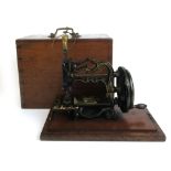 A Victorian hand crank sewing machine by James Weir,