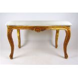 A 19th style century French giltwood stool, the serpentine seat on carved and moulded legs, h.