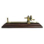 A 19th century brass and mahogany mounted tensile strength gauge by Goodbrand & Co of Manchester, l.