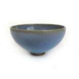 A Chinese pottery flambe glazed bowl, dia.