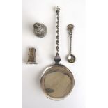 A selection of silver and white metal items to include a wax holder, condiment spoon,