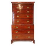 A George III mahogany and rosewood banded chest on chest,