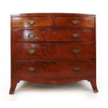 A late 18th century mahogany chest of two short over three long drawers on swept feet, h. 95 cm, w.