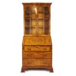 An early 20th century walnut bureau bookcase in the early 18th century style,