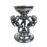 A 19th century French silver plated centrepiece modelled as three putti supporting a bowl, h.