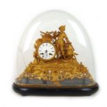 A late 19th century gilt metal mantle clock under broken glass dome,