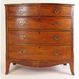 A late 18th century mahogany and ebony strung bow front chest of two short over three drawers on