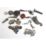 An assortment of silver and white metal jewellery to include brooches, ring, albertina bracelet etc.