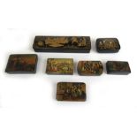 A group of six 19th century lacquered and painted snuff boxes and one pen case depicting various