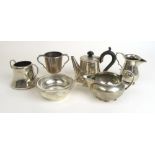 An assortment of silver items to include a small teapot, cream jug, trophy etc. Various hallmarks.