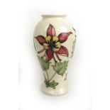 A Moorcroft 'Columbine' pattern inverted baluster vase decorated on a cream ground, h.