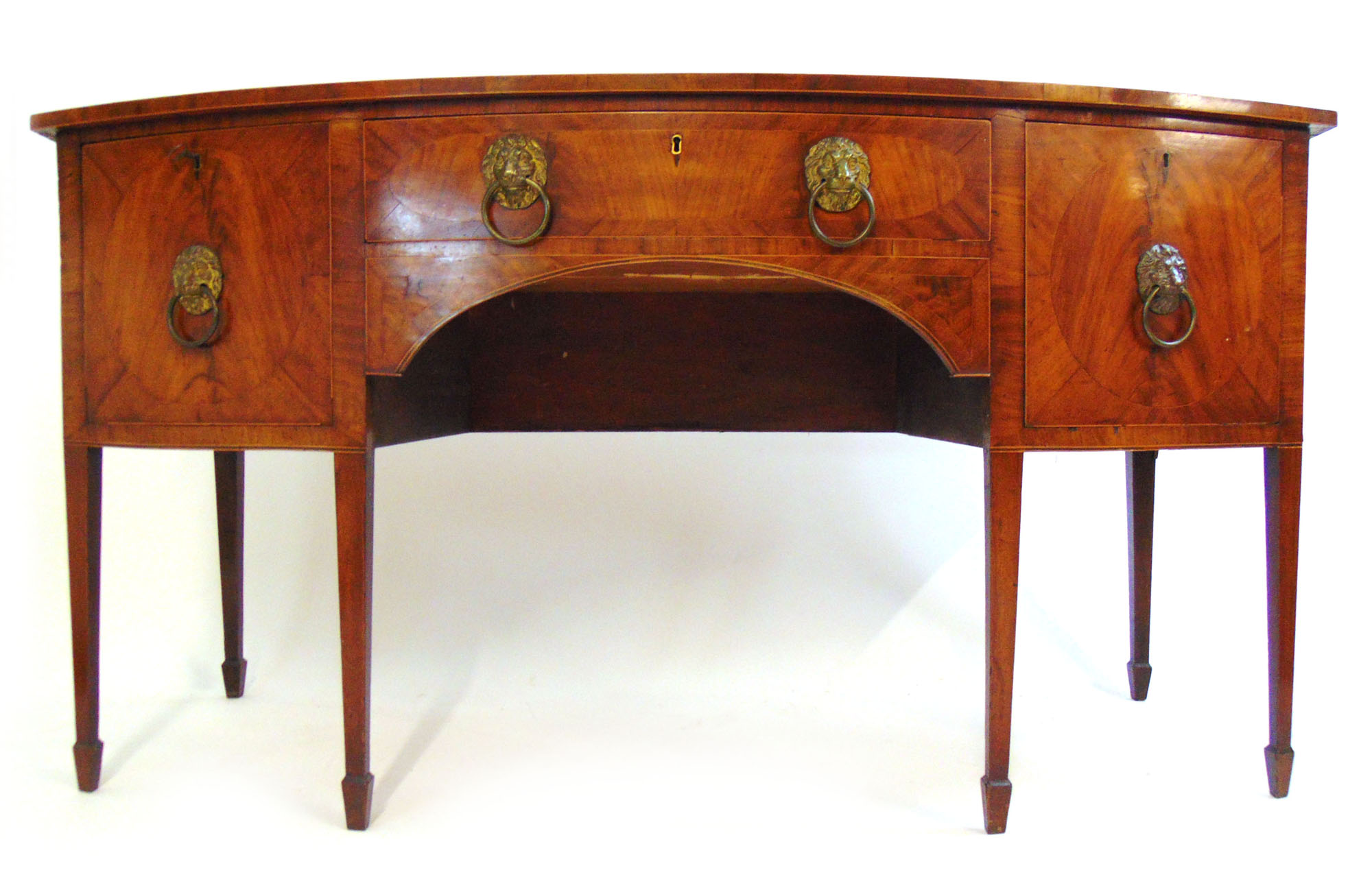 An early 19th century mahogany and boxwood strung bow front sideboard,