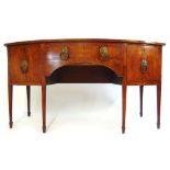 An early 19th century mahogany and boxwood strung bow front sideboard,