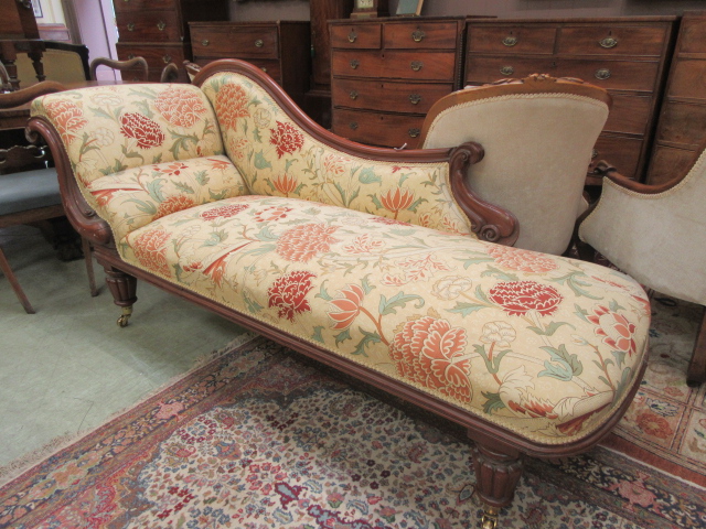 A Victorian mahogany chaise lounge upholstered in a Morris fabric, 91 cm, l. 198 cm, d.