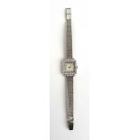 A ladies 9ct white gold and diamond set cocktail watch.