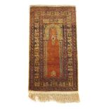 A handwoven Turkish prayer rug,