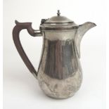 A George V silver hot water jug.