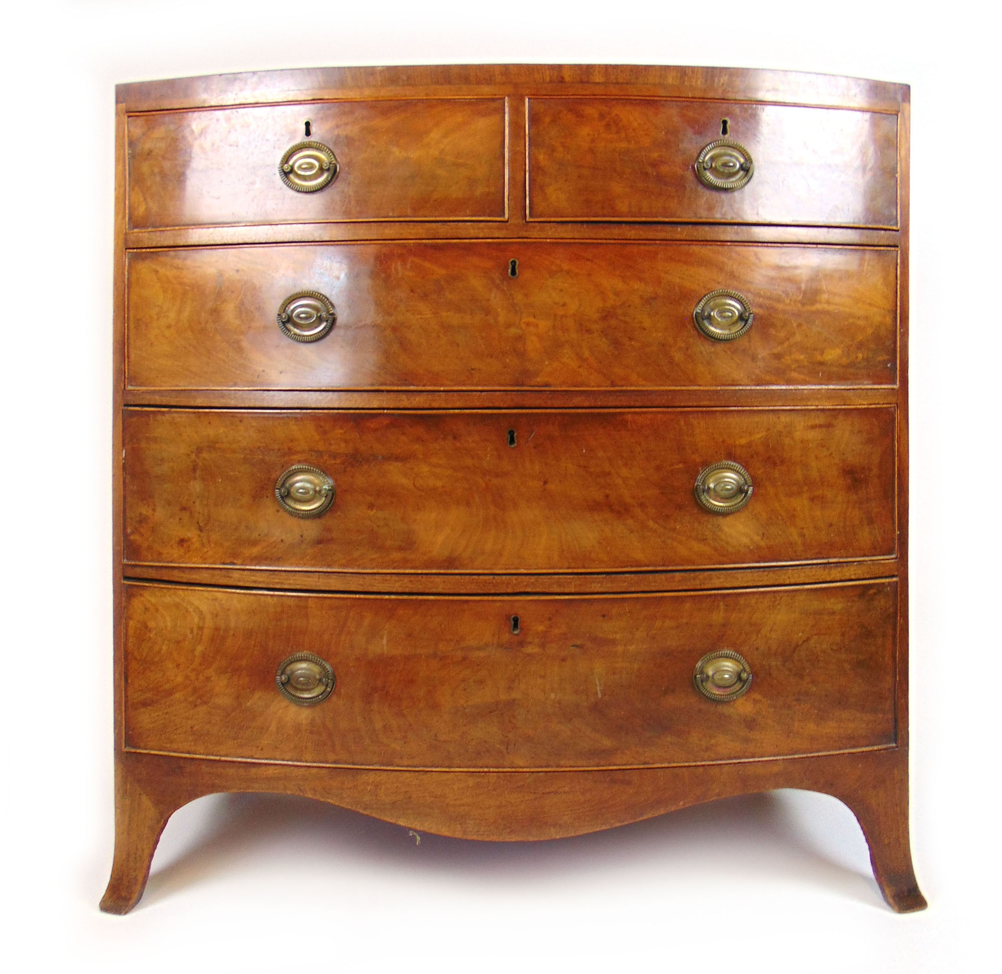 A late 18th century mahogany bow front chest of two short over three long drawers on splay feet, h.