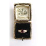 An early 20th century yellow metal, ruby and diamond ring marked '18ct',