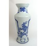 A large early 20th century Chinese blue and white porcelain vase having floral decoration and