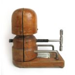 An early 20th century milliners wooden hat stretcher block, h.