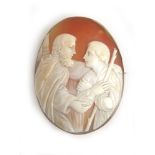 A Victorian yellow metal mounted carved shell cameo depicting a religious scene, l. 5.8 cm.