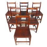 A set of five early 19th century elm and walnut dining chairs,